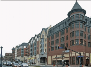 Row of Buildings with the Corner One Having a Cone Shape