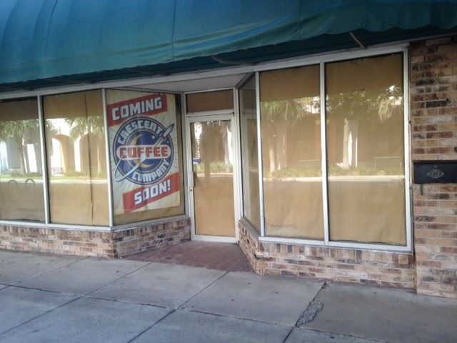 Photo of a storefront with a sign that reads Crescent Coffee Company.
